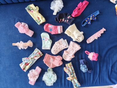 20 assorted pieces of like new girls hair bands and socks