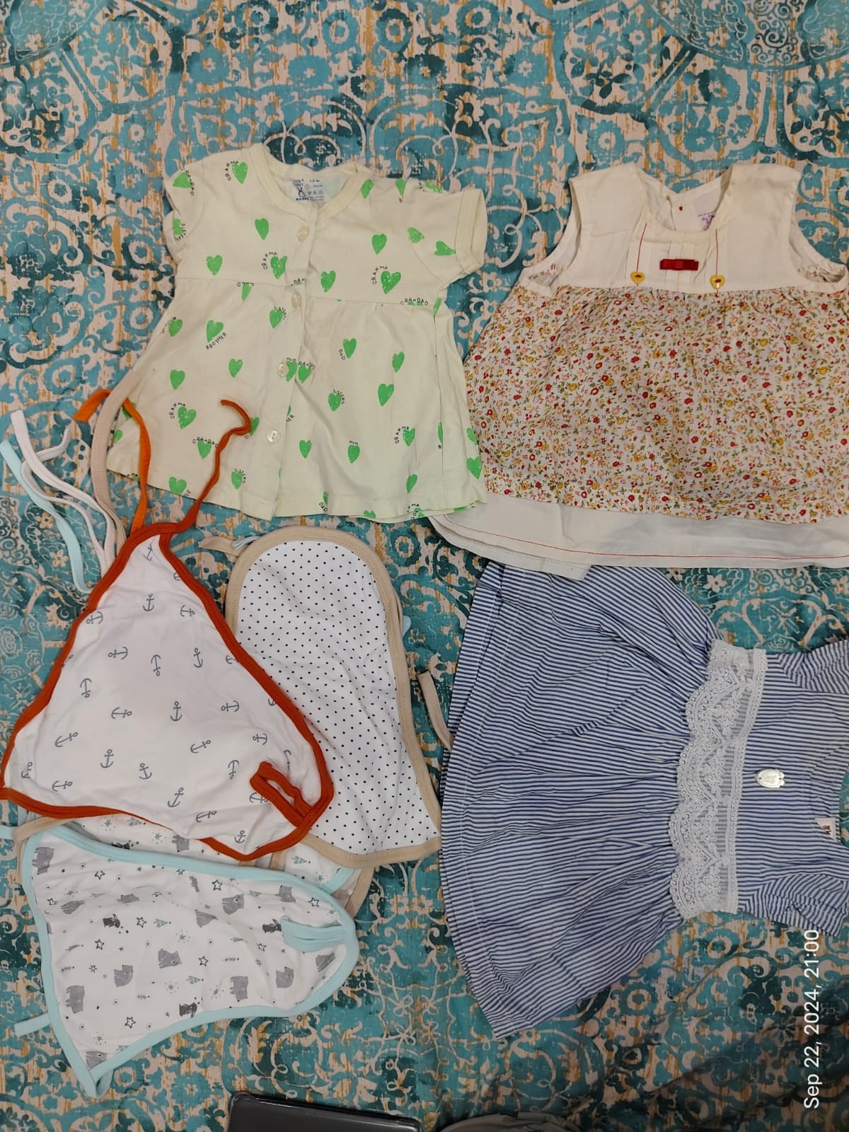 Assorted set of preloved soft cotton clothing items for baby (0-3 months)