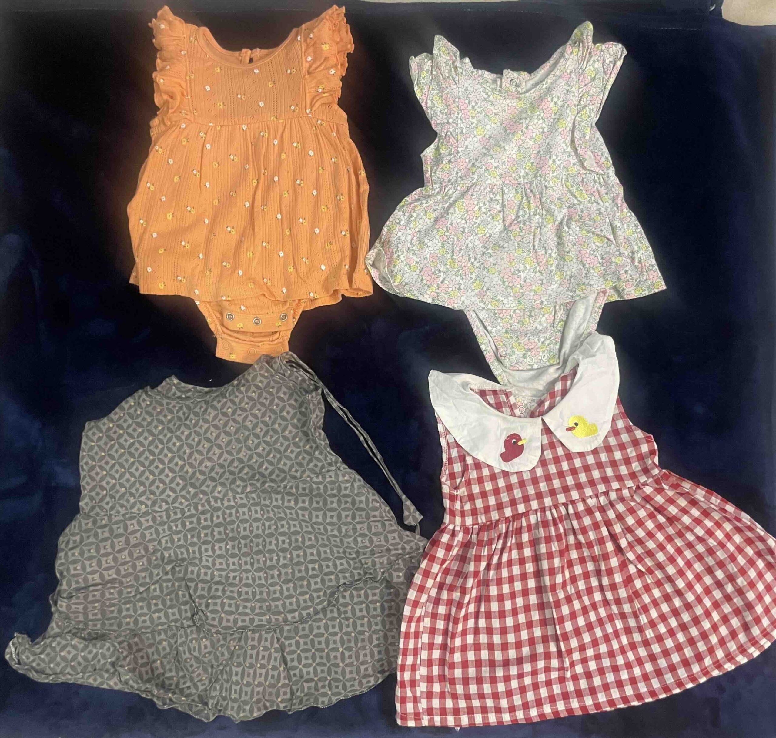 Secondhand set of 4 assorted cotton dresses for baby girl (6-9 months)