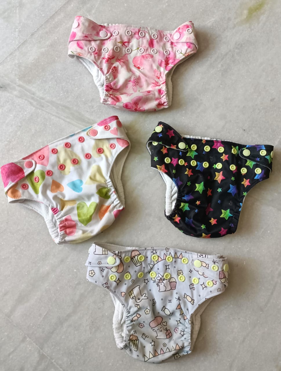 Secondhand Superbottoms uno cloth diapers with unused insert