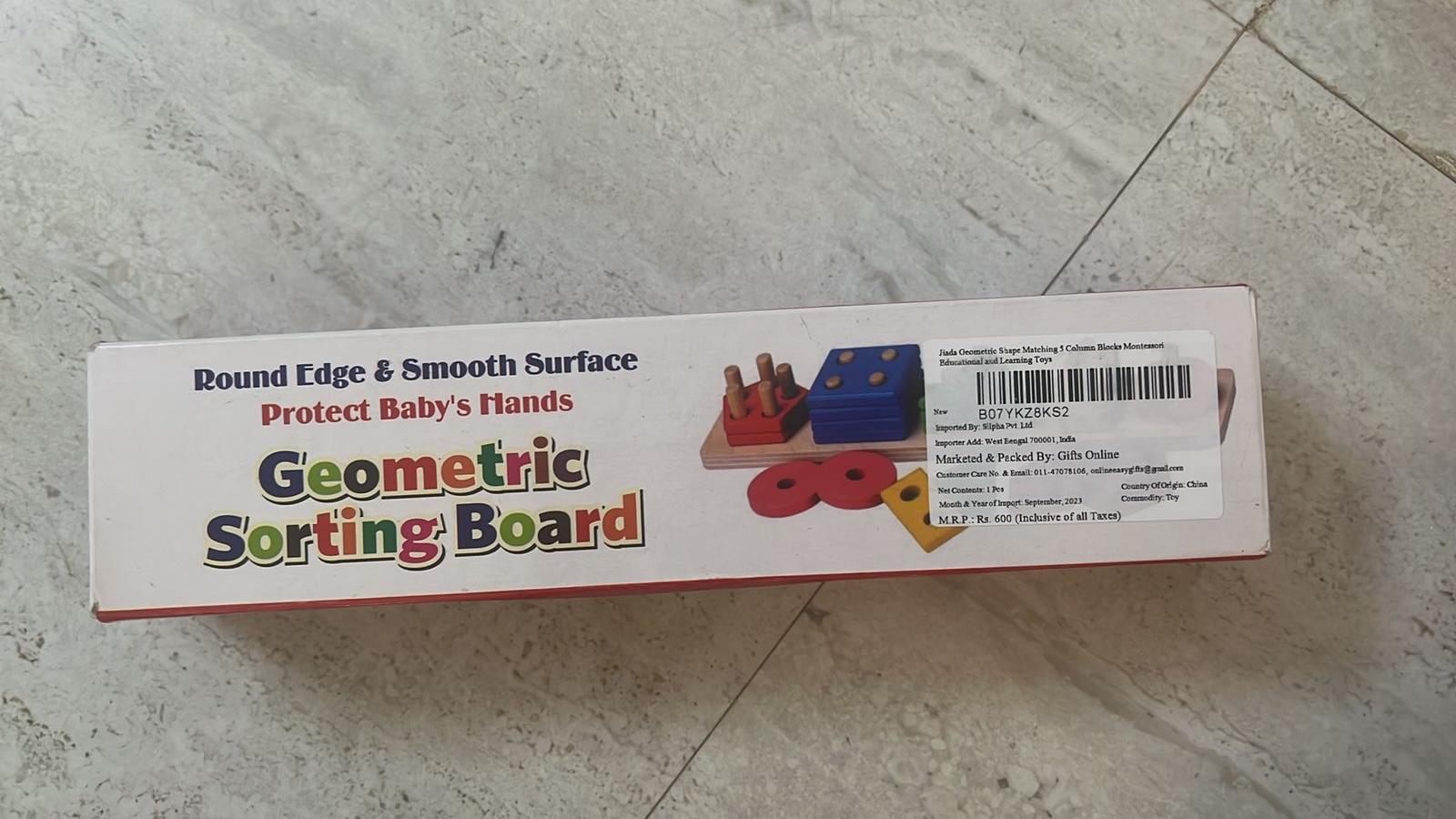 Preowned but unused NEW Geometric sorting board puzzle for kids