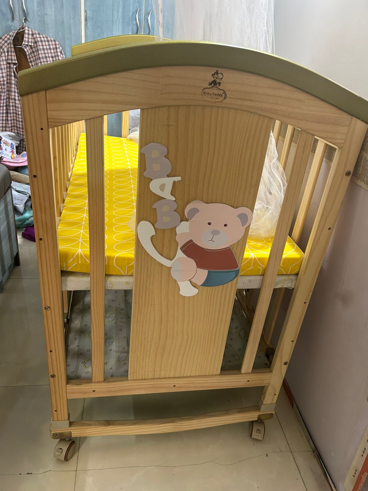 Secondhand Gently used wooden baby cot with mattress and mosquito net for sale in Mumbai