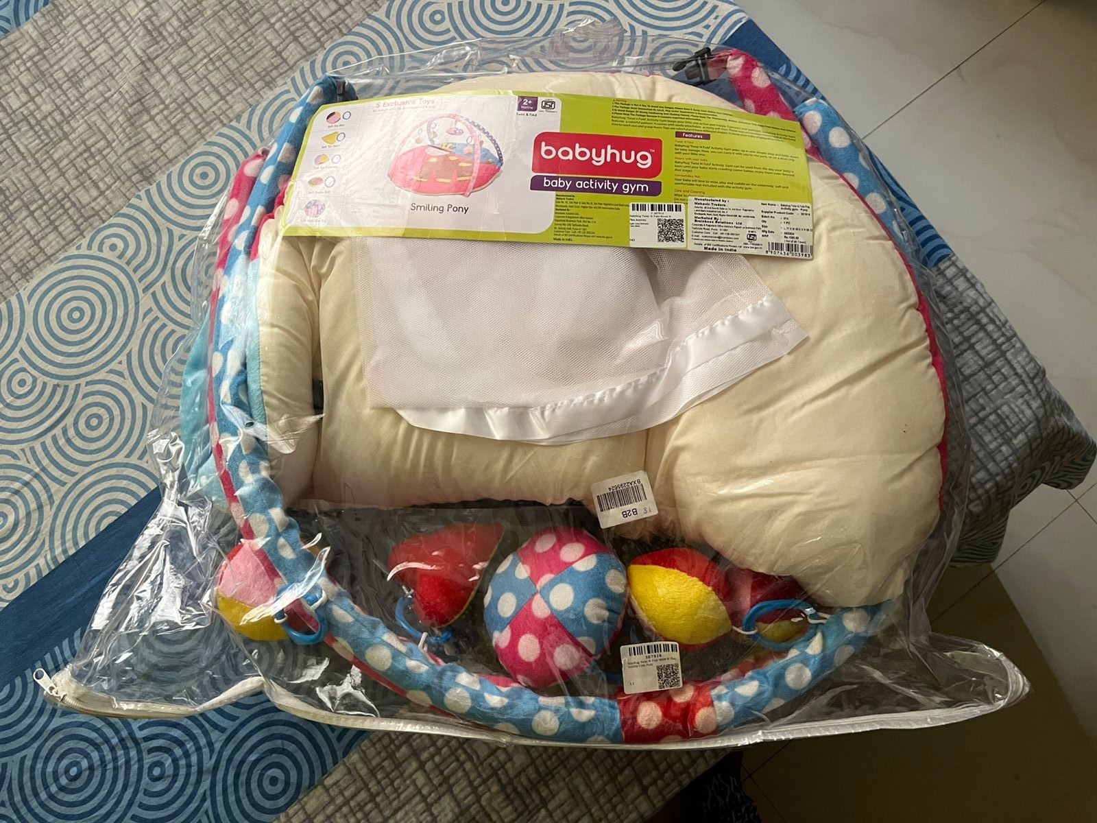 Thrifted Babyhug baby gym with hanging toys and mosquito net