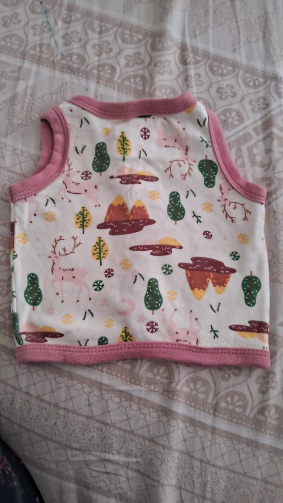 Preowned newborn baby shirt in soft, safe fabric