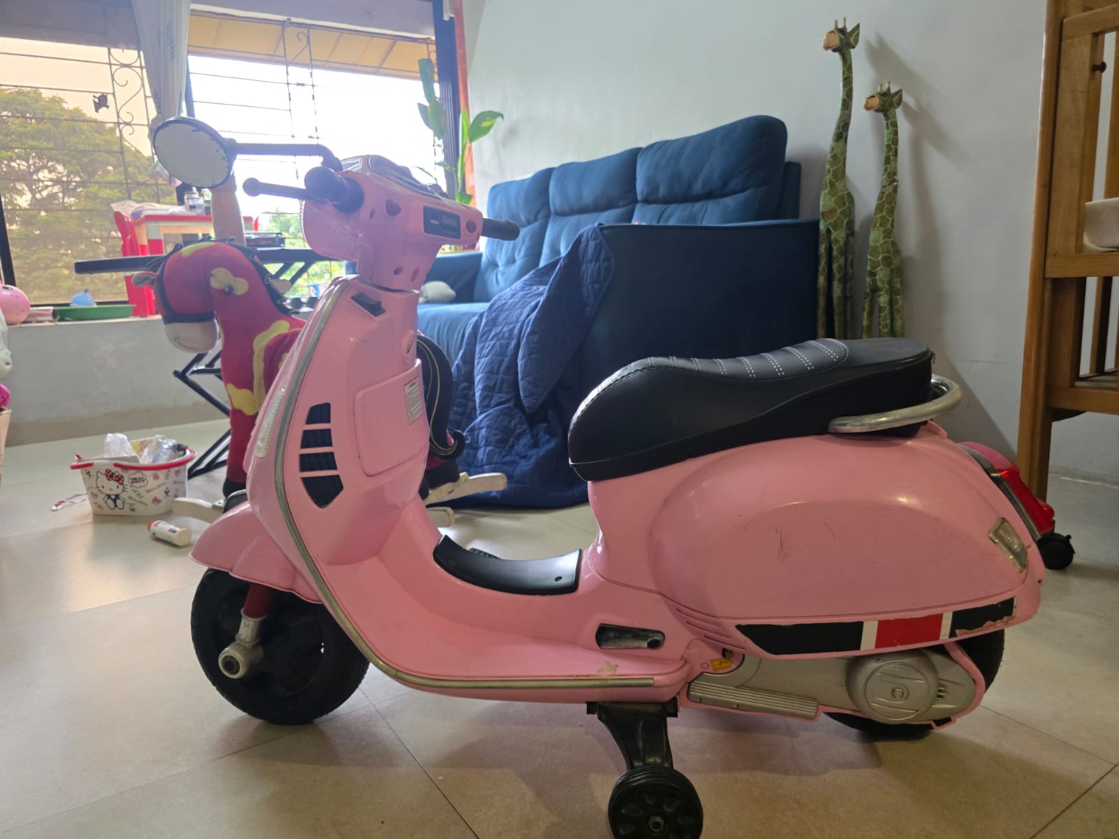 Preowned gently used pink kids electric battery scooter ride on for sale in Mumbai