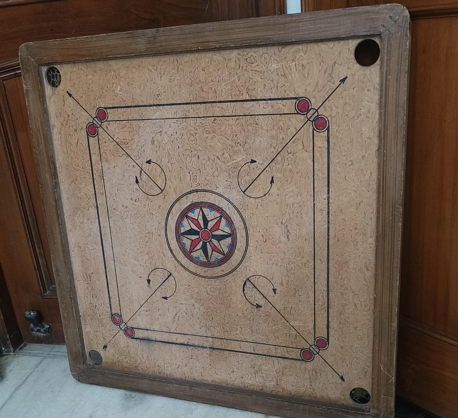 Preowned large carrom board with coins in good condition
