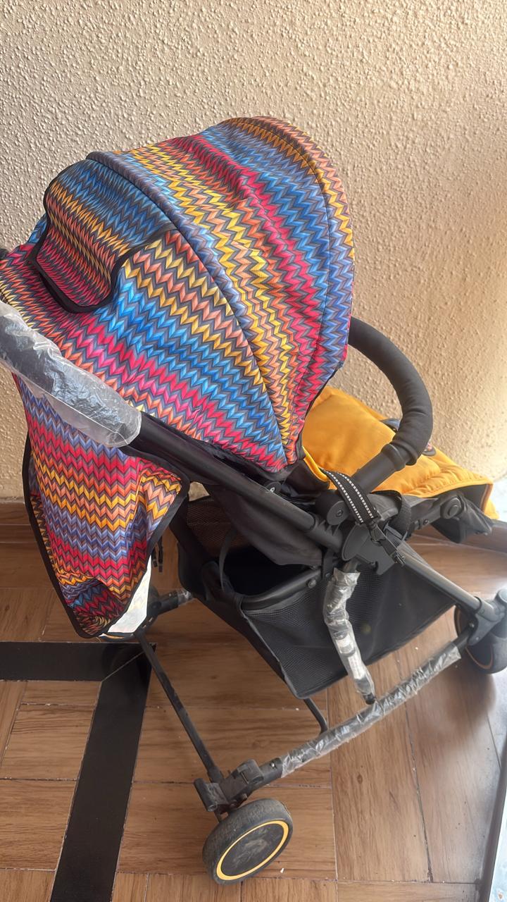 Secondhand Babyhug rocker stroller in good condition