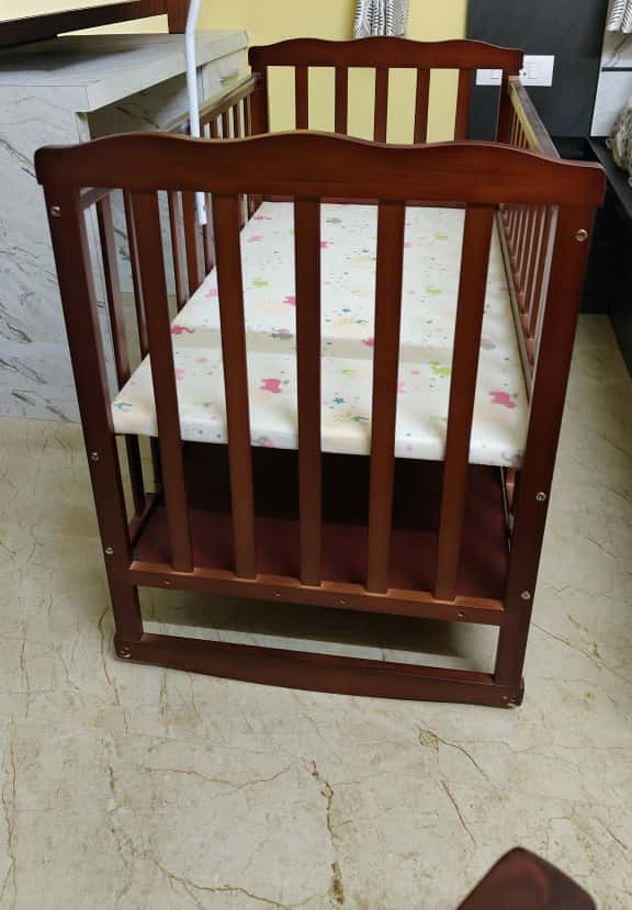 Preowned Babyhug Montana cot in good condition