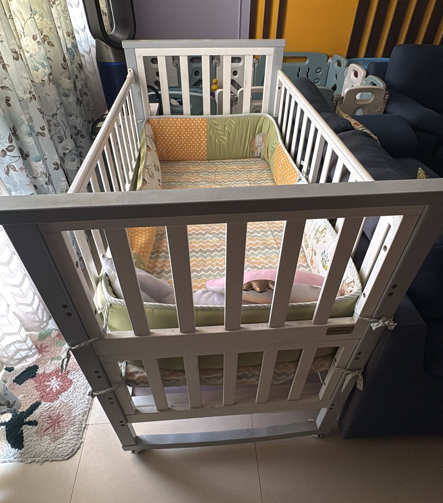 Preowned Babyhug baby cot in good condition